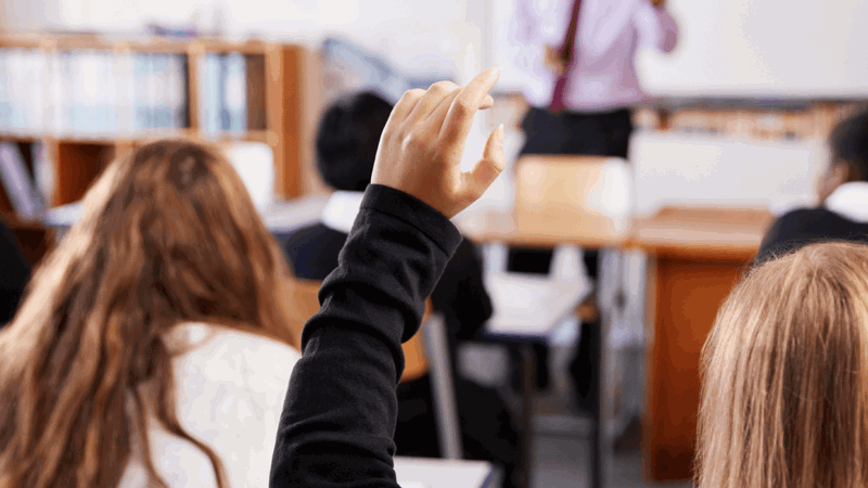 Classroom, girl with hand up