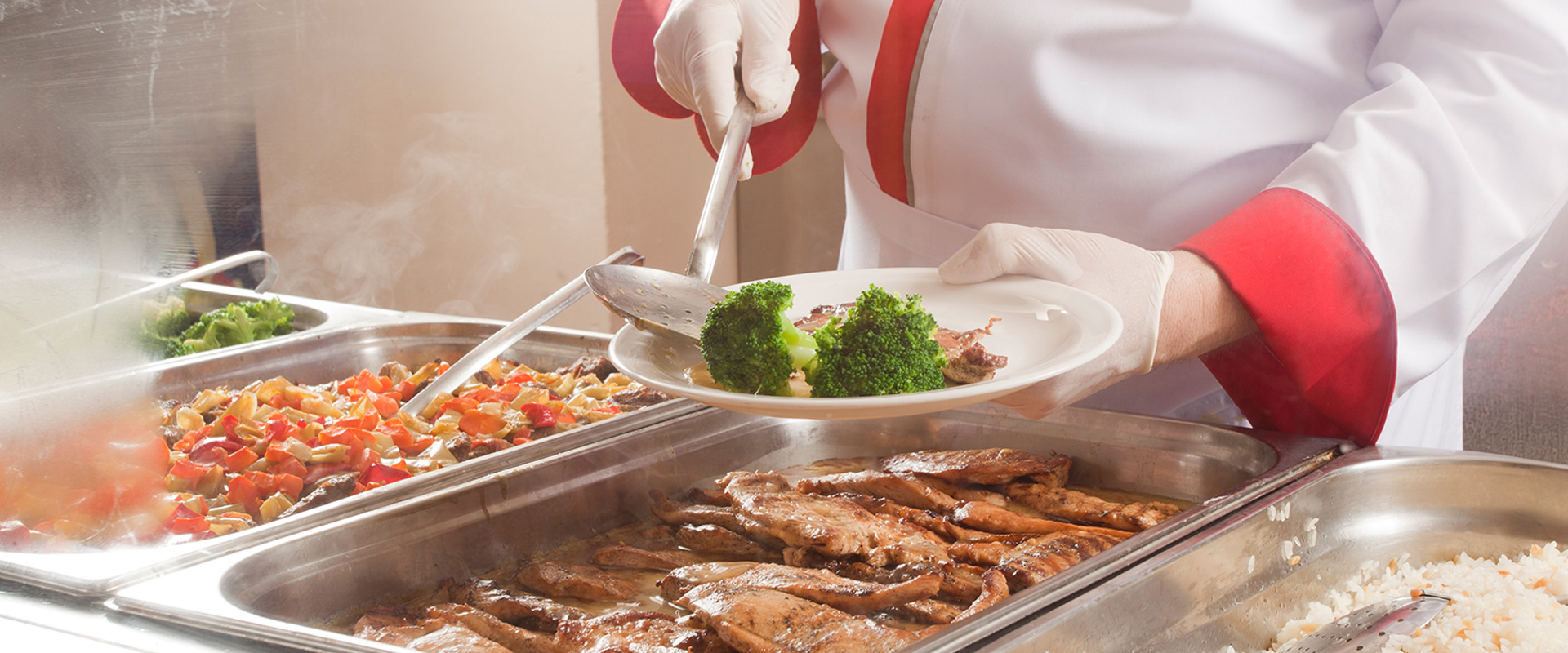 Kitchen worker providing Catering Services at school
